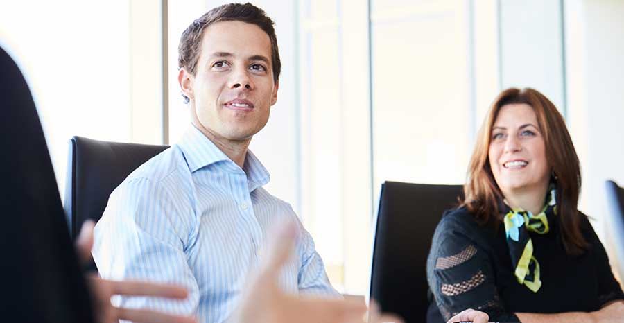 People at a workplace positively discussing something