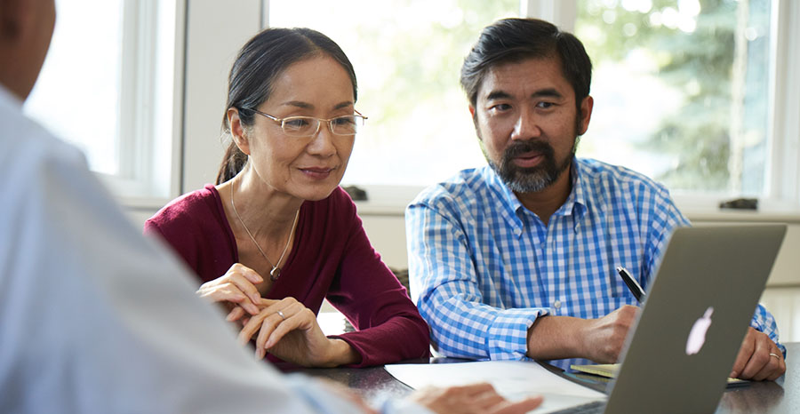Couple discussing plans with a financial professional