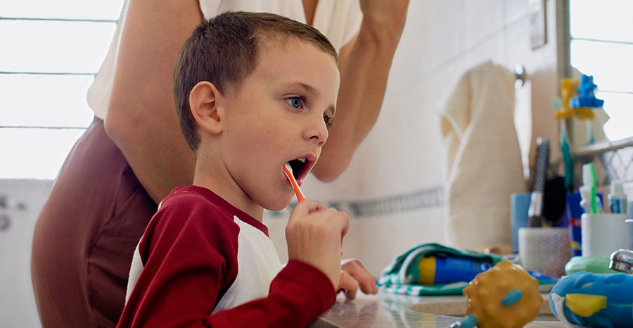 A child brushing teeth