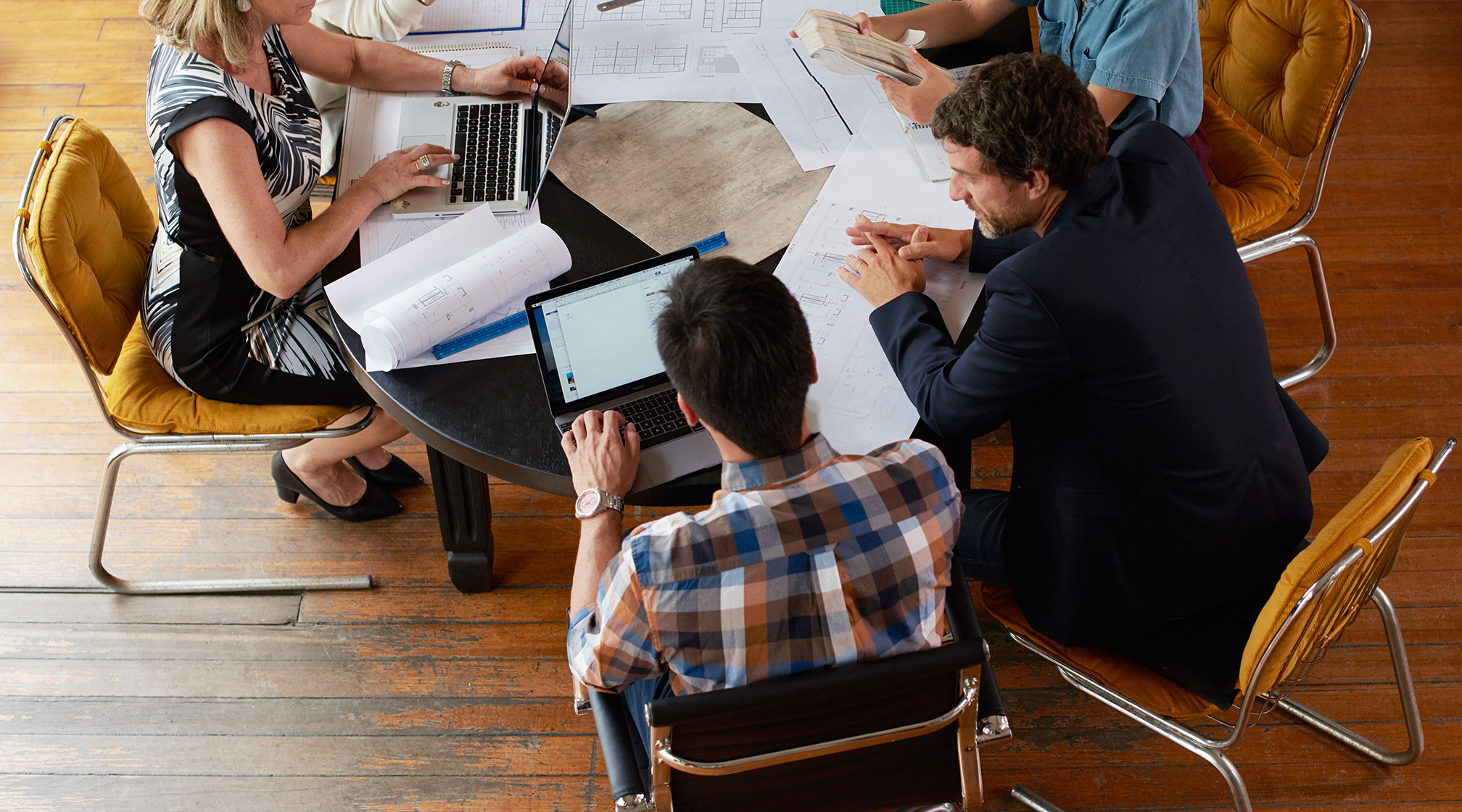 People collaborating at a workplace and sharing their views