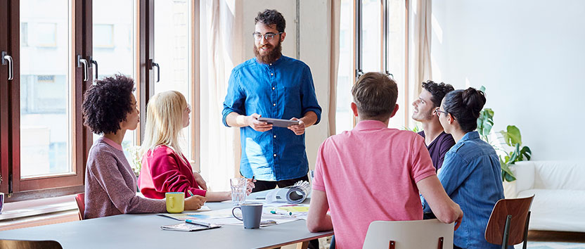 Employees gather at meeting room for discussion