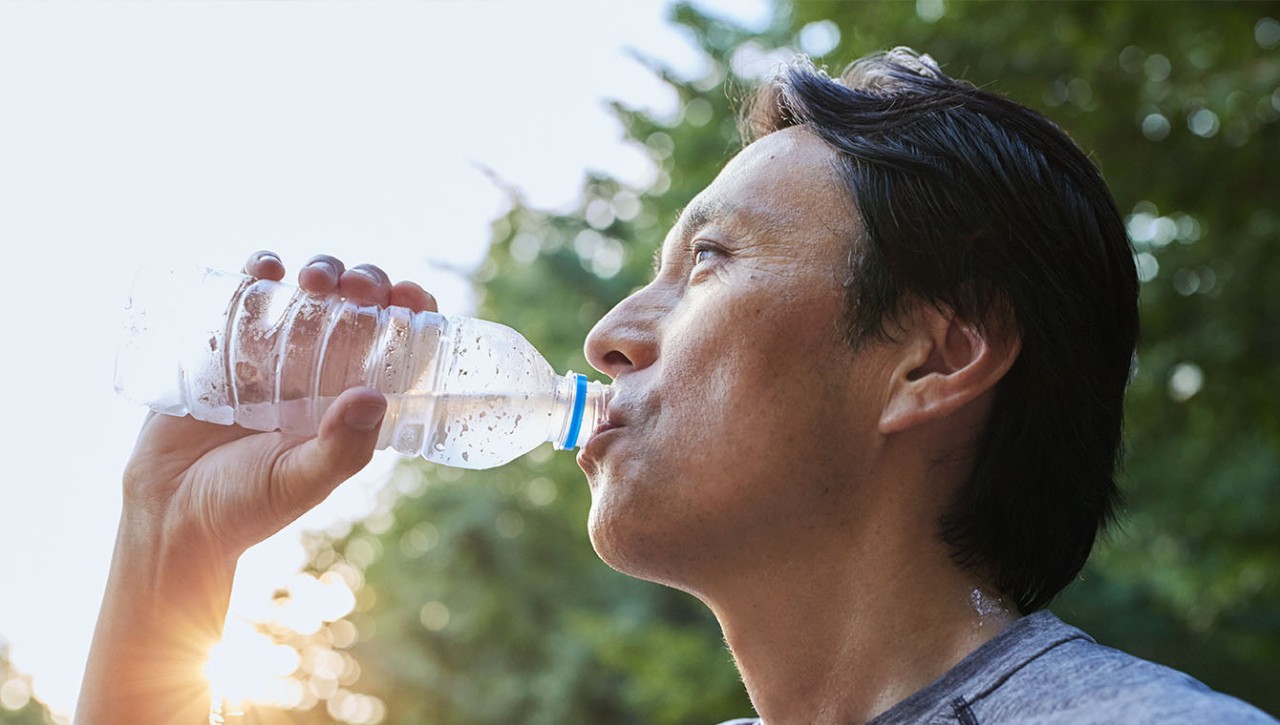 A man is drinking water